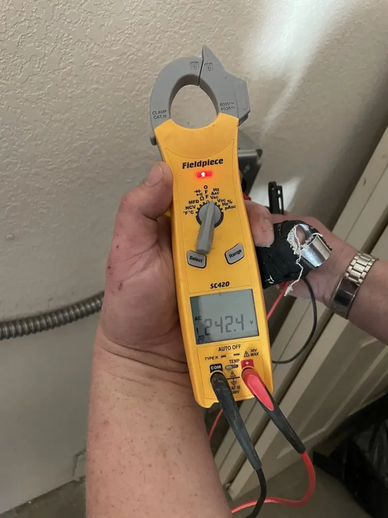 Voltage testing with clamp meter during Generator Installation in Franklin Town
